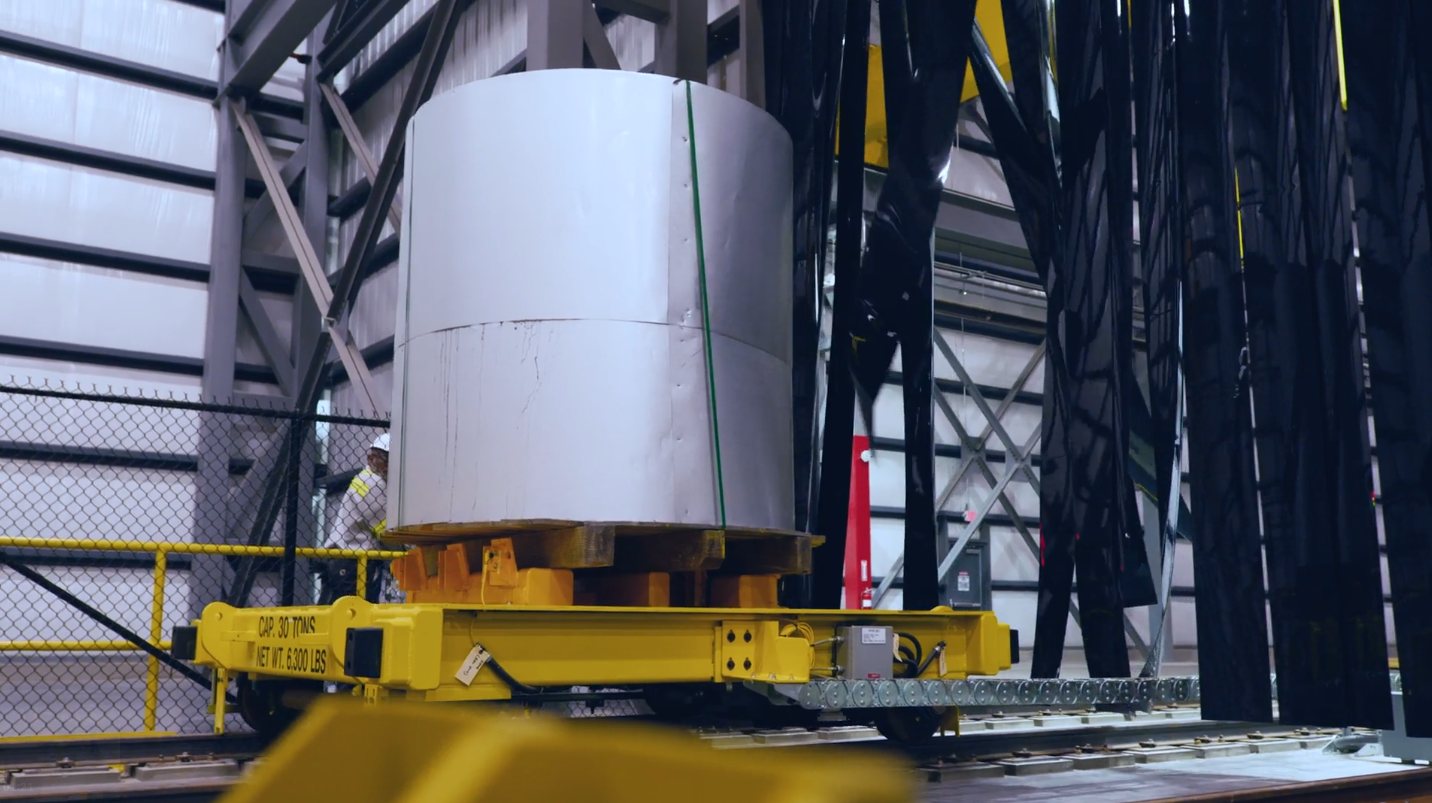 Palletized steel coil on a transfer car